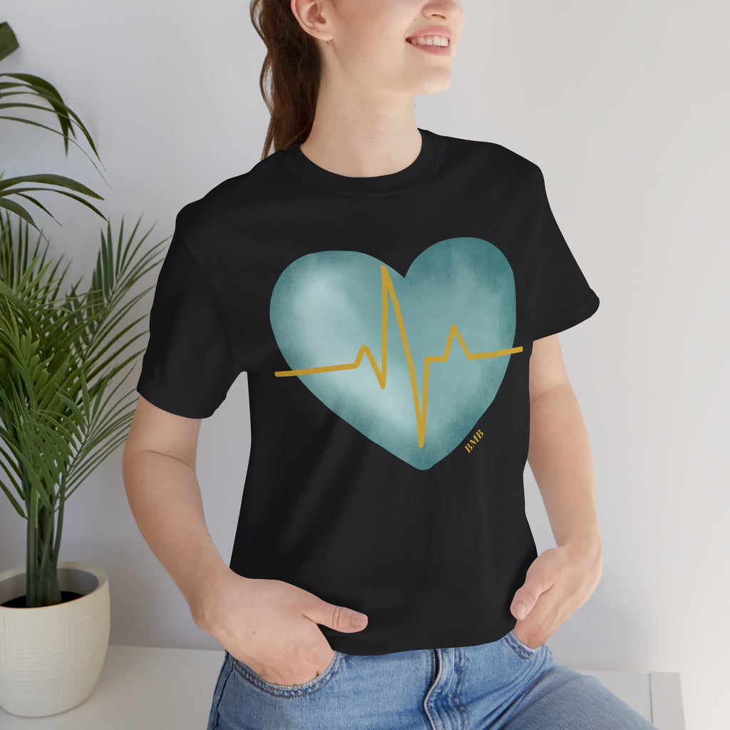 Woman wearing black Heartbeat Heart Tee with teal watercolor heart and gold EKG line — nurse gift shirt