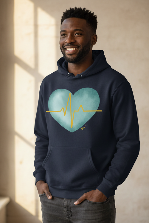 Black man wearing navy Heartbeat Heart Hoodie with teal watercolor heart and gold EKG line — nurse gift hoodie