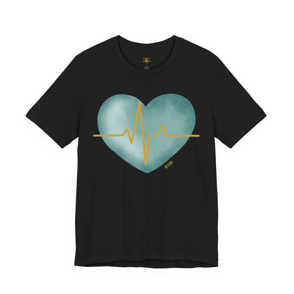 Black Heartbeat Heart Tee flat lay with teal watercolor heart and gold EKG line — medical gift shirt